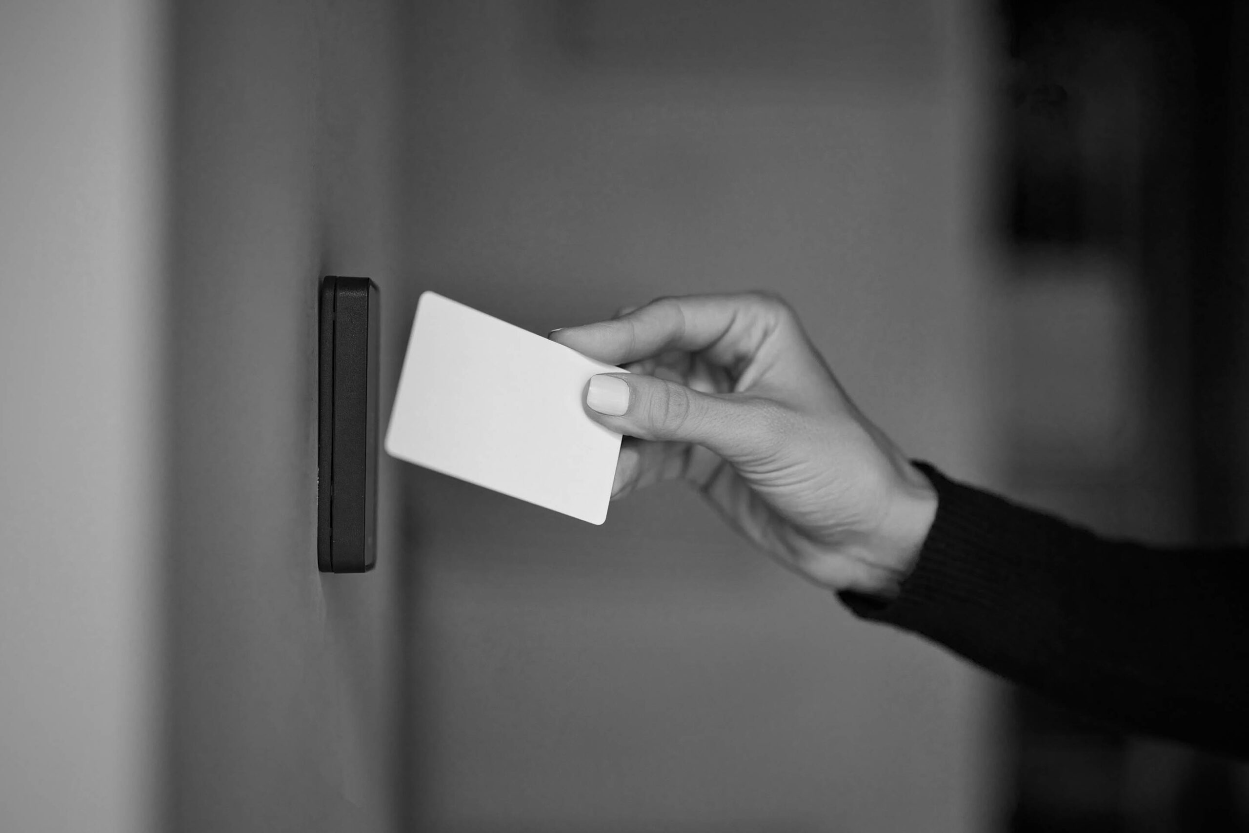 Close up,Of,A,Female,Hand,Holding,A,Card,For,Door